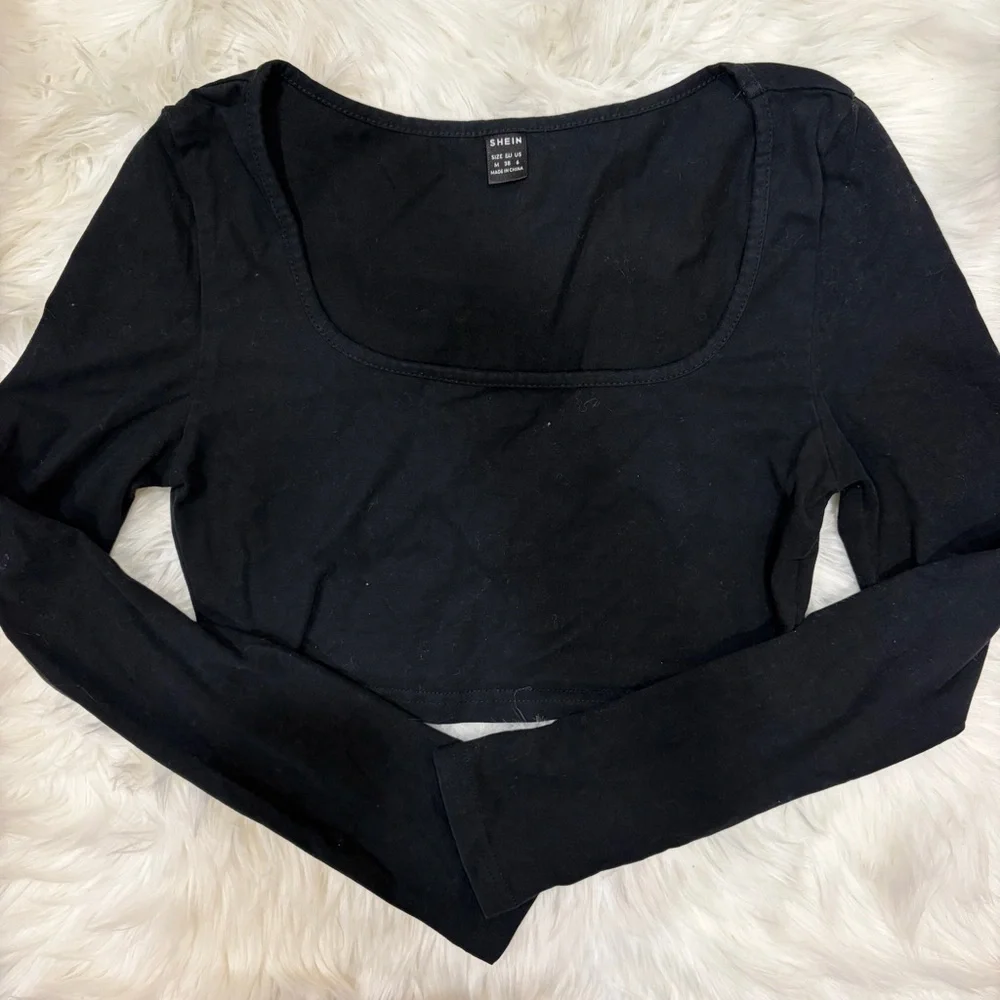 Black cropped long sleeve top